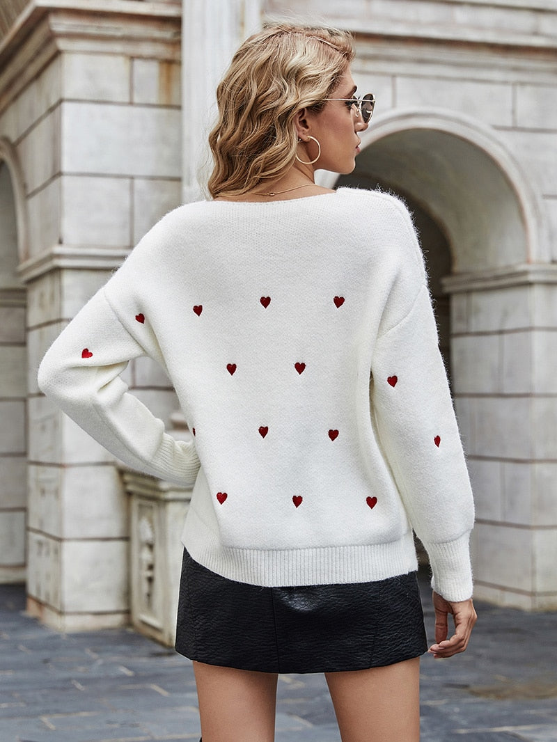 Pull motif coeurs décolleté plongeant