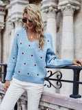 Pull motif coeurs décolleté plongeant