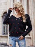 Pull motif coeurs décolleté plongeant